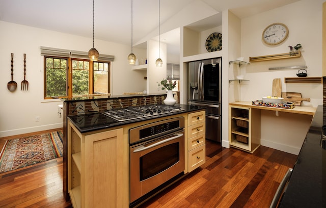 1138 Vallecito Rd, Carpinteria, CA 93013 - kitchen with stainless steel appliances, dark wood-style flooring, dark countertops, pendant lighting, and a kitchen island