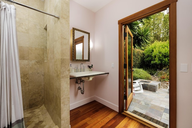 1138 Vallecito Rd, Carpinteria, CA 93013 - bathroom featuring tiled shower and wood finished floors