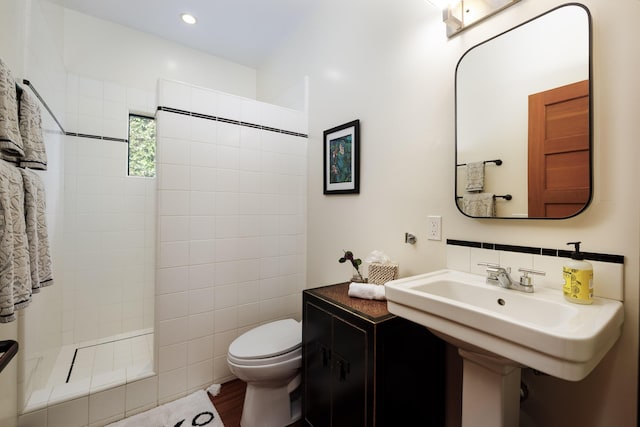 1138 Vallecito Rd, Carpinteria, CA 93013 - bathroom featuring a tile shower and wood finished floors