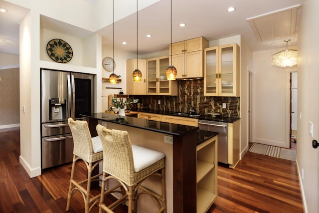 1138 Vallecito Rd, Carpinteria, CA 93013 - bar area with appliances with stainless steel finishes, dark wood finished floors, decorative backsplash, pendant lighting, and recessed lighting