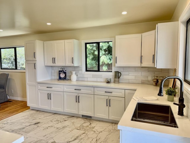 19 W Quinto St, Santa Barbara, CA 93105 - kitchen with healthy amount of natural light, light countertops, recessed lighting, backsplash, and white cabinets