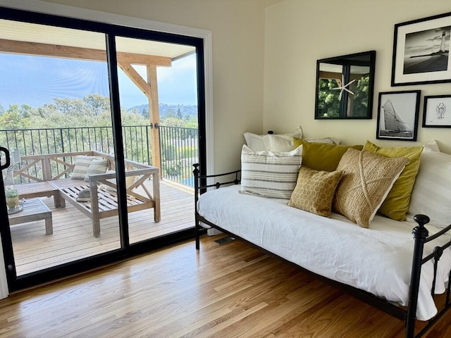 19 W Quinto St, Santa Barbara, CA 93105 - bedroom with access to outside, wood finished floors, and multiple windows