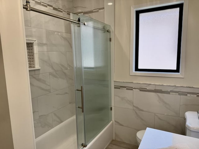 19 W Quinto St, Santa Barbara, CA 93105 - full bath featuring tile walls, shower / bath combination with glass door, and wainscoting