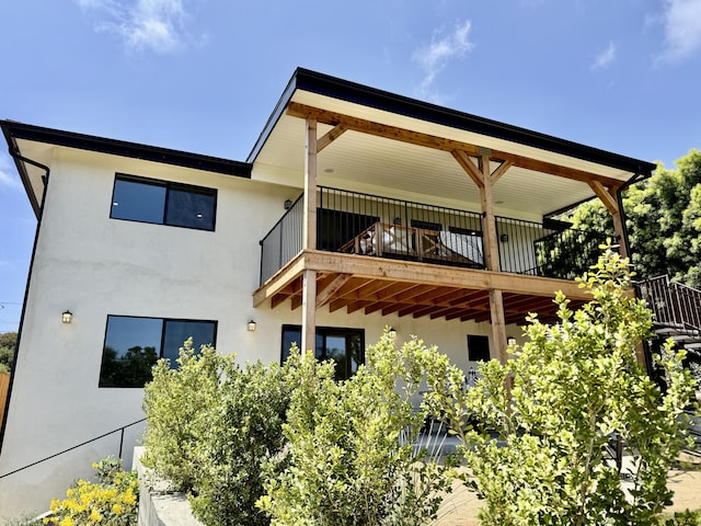 19 W Quinto St, Santa Barbara, CA 93105 - back of house featuring stucco siding and a balcony