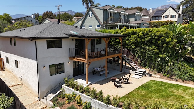 19 W Quinto St, Santa Barbara, CA 93105 - back of property with a patio, stucco siding, a balcony, stairs, and roof with shingles