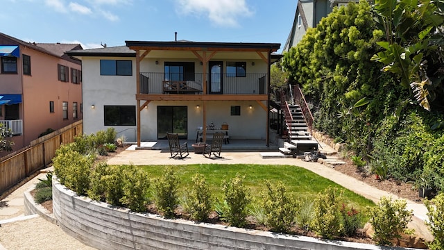 19 W Quinto St, Santa Barbara, CA 93105 - rear view of property with stucco siding, a patio, stairs, and a balcony