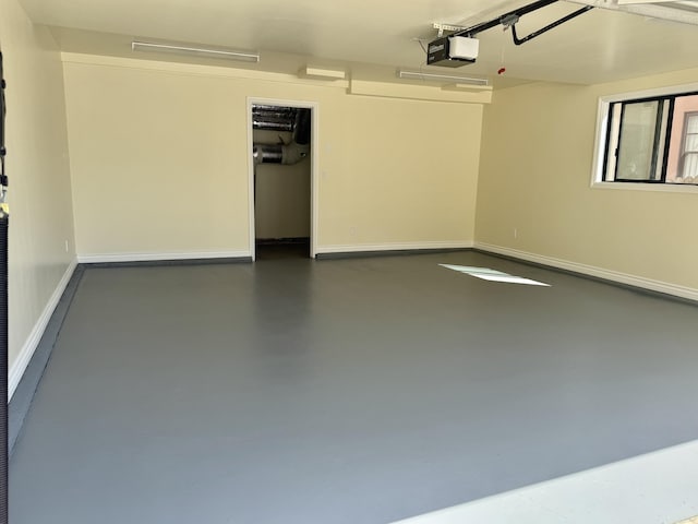 19 W Quinto St, Santa Barbara, CA 93105 - garage featuring a garage door opener and baseboards
