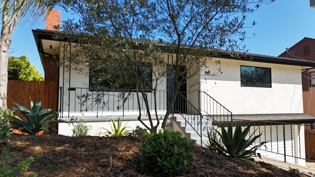 19 W Quinto St, Santa Barbara, CA 93105 - view of front of home with stucco siding and a chimney