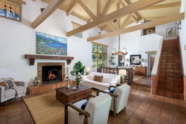 601 San Ysidro Rd, Santa Barbara, CA 93108 - living area with a warm lit fireplace, high vaulted ceiling, a wooden ceiling with exposed beams, and a chandelier
