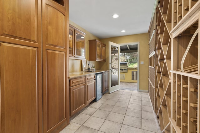230 Avocado Pl, Camarillo, CA 93010 - kitchen with recessed lighting, brown cabinetry, light tile patterned floors, glass insert cabinets, and beverage cooler