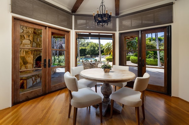 771 Via Manana, Montecito, CA 93108 - dining space with french doors, a chandelier, light wood-style floors, healthy amount of natural light, and beam ceiling