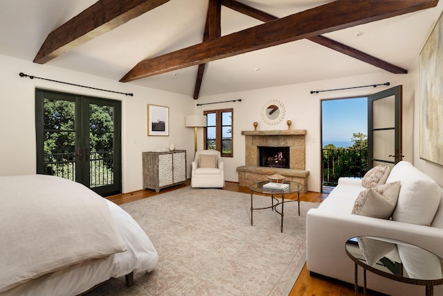 771 Via Manana, Montecito, CA 93108 - bedroom featuring access to exterior, wood finished floors, and a stone fireplace