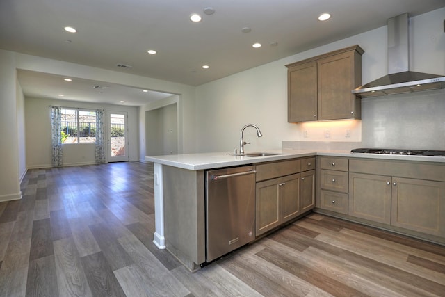 6628 Sand Castle Pl Unit C-7, Goleta, CA 93117 - kitchen with wall chimney exhaust hood, stainless steel dishwasher, gas stovetop, light wood-style flooring, and recessed lighting