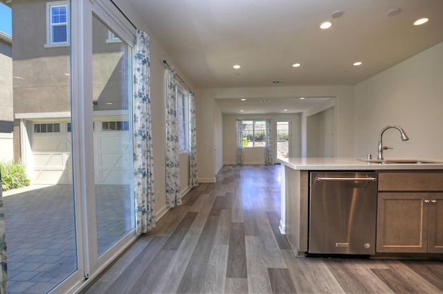 6628 Sand Castle Pl Unit C-7, Goleta, CA 93117 - kitchen featuring dishwasher, wood finished floors, light countertops, recessed lighting, and open floor plan