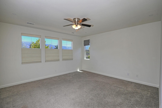 6628 Sand Castle Pl Unit C-7, Goleta, CA 93117 - spare room with a ceiling fan and dark carpet