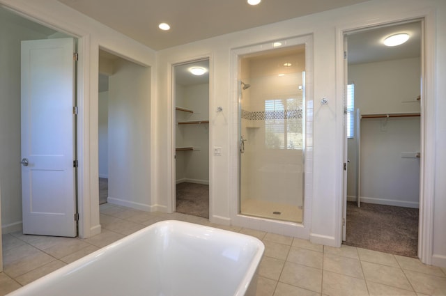 6628 Sand Castle Pl Unit C-7, Goleta, CA 93117 - full bathroom featuring a spacious closet, a stall shower, a soaking tub, tile patterned flooring, and recessed lighting