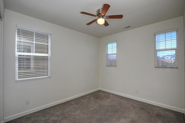 6628 Sand Castle Pl Unit C-7, Goleta, CA 93117 - spare room with dark colored carpet and a ceiling fan