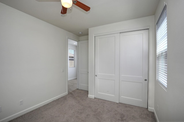 6628 Sand Castle Pl Unit C-7, Goleta, CA 93117 - unfurnished bedroom featuring carpet, multiple windows, a closet, and a ceiling fan