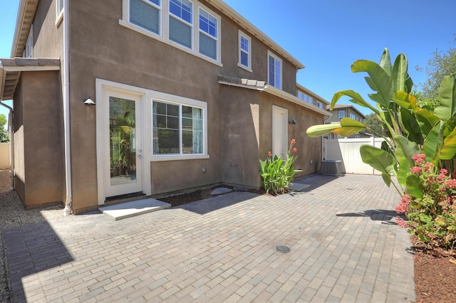 6628 Sand Castle Pl Unit C-7, Goleta, CA 93117 - back of house with stucco siding, a patio area, and a gate