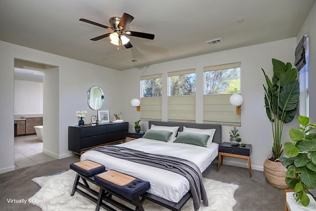 6628 Sand Castle Pl Unit C-7, Goleta, CA 93117 - bedroom with light carpet, ensuite bath, and ceiling fan