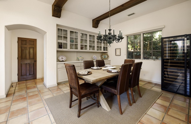 1439 Tunnel Rd, Santa Barbara, CA 93105 - dining room featuring wine cooler, beam ceiling, a chandelier, and light tile patterned floors