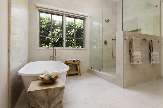1439 Tunnel Rd, Santa Barbara, CA 93105 - bathroom featuring tile walls, a freestanding tub, a walk in shower, and tile patterned flooring