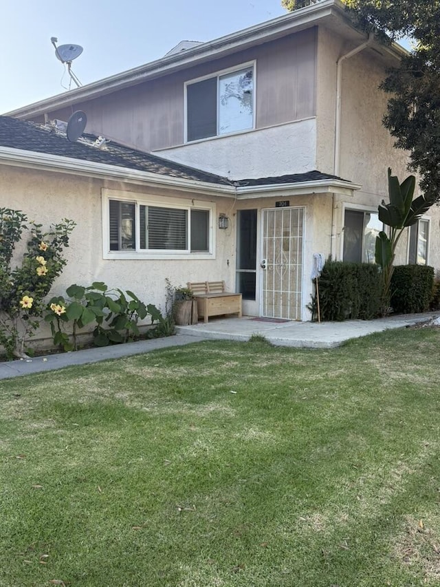 701 Halyard St, Port Hueneme, CA 93041 - view of front of property featuring stucco siding, a front lawn, and a patio area