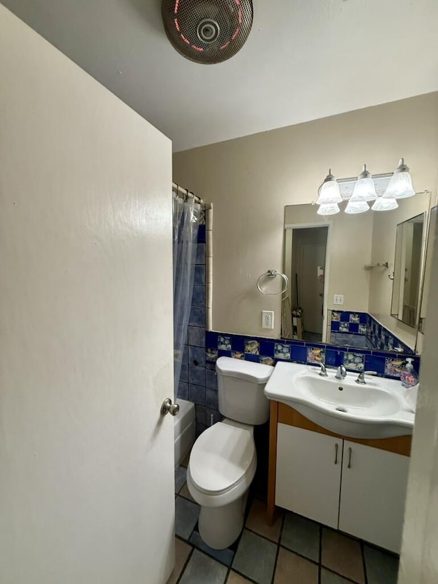701 Halyard St, Port Hueneme, CA 93041 - bathroom with vanity, tile patterned floors, tile walls, and shower / bath combination with curtain