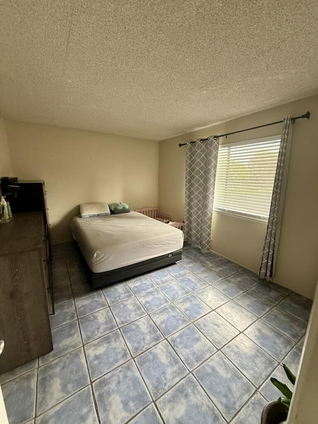701 Halyard St, Port Hueneme, CA 93041 - tiled bedroom with a textured ceiling