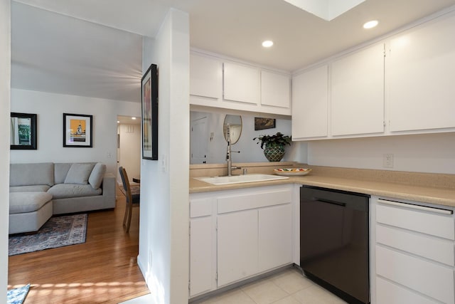 521 W Montecito St Unit 4, Santa Barbara, CA 93101 - kitchen with dishwasher, light countertops, white cabinetry, light wood-type flooring, and recessed lighting