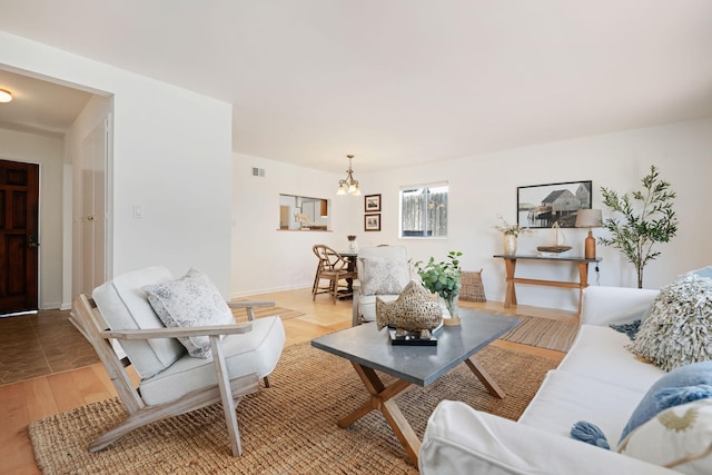 7234 Del Norte Dr, Goleta, CA 93117 - living area with a chandelier and light wood-type flooring