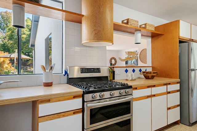 7234 Del Norte Dr, Goleta, CA 93117 - kitchen featuring stainless steel appliances, tasteful backsplash, white cabinetry, and open shelves