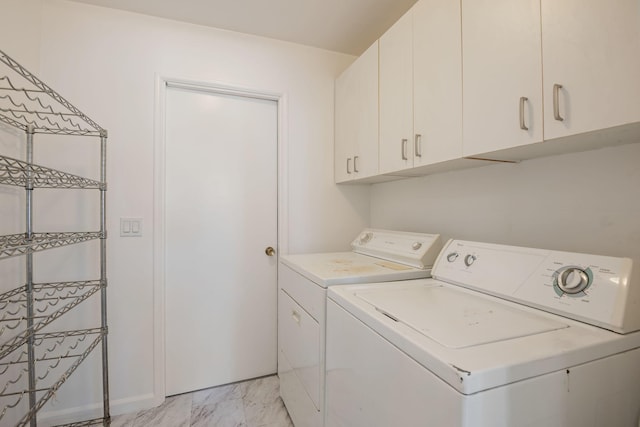 7234 Del Norte Dr, Goleta, CA 93117 - laundry room featuring washer and clothes dryer, cabinet space, and light marble finish floors