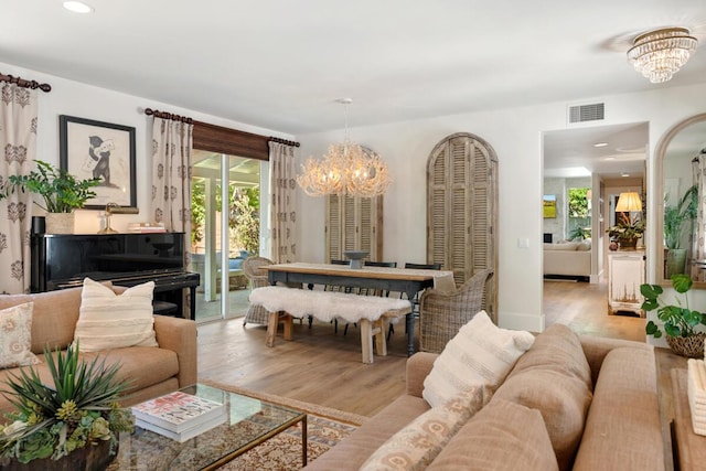 2807 Gaviota St, Los Olivos, CA 93441 - living room with a chandelier, wood finished floors, healthy amount of natural light, and recessed lighting