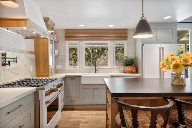 2807 Gaviota St, Los Olivos, CA 93441 - kitchen featuring high quality appliances, custom range hood, gray cabinetry, light wood finished floors, and recessed lighting