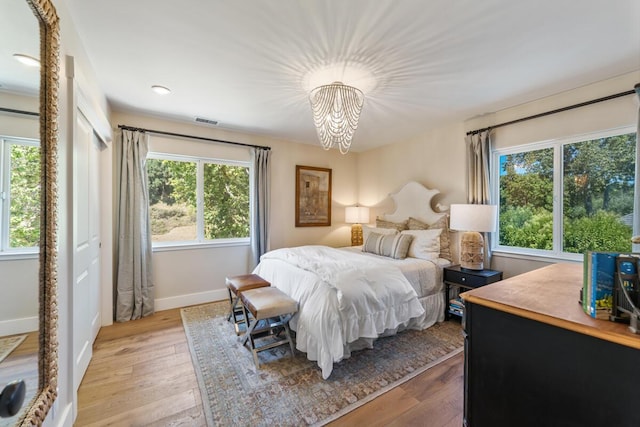 2807 Gaviota St, Los Olivos, CA 93441 - bedroom featuring a chandelier and light wood-style floors