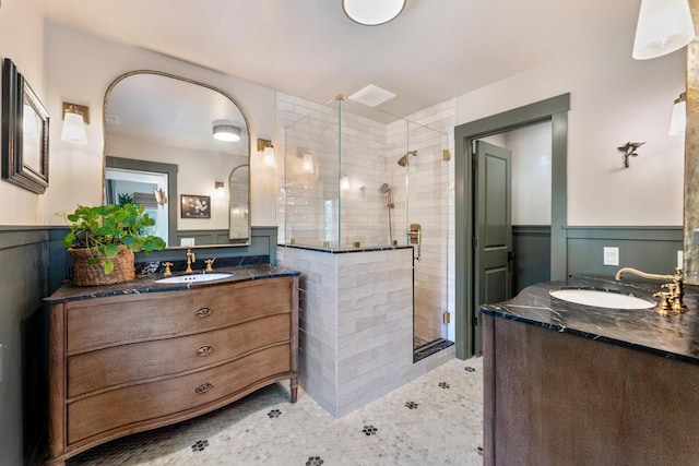 2807 Gaviota St, Los Olivos, CA 93441 - bathroom featuring a wainscoted wall, a shower stall, and two vanities