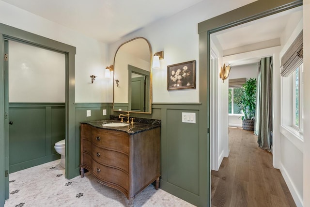 2807 Gaviota St, Los Olivos, CA 93441 - bathroom featuring a wainscoted wall, vanity, a decorative wall, and wood finished floors