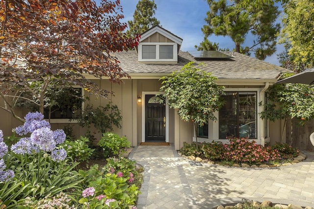 5118 Concord Pl, Carpinteria, CA 93013 - view of front of property featuring roof mounted solar panels and roof with shingles