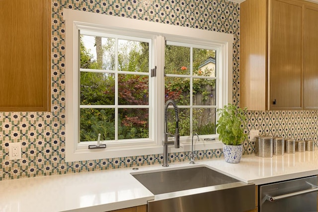 5118 Concord Pl, Carpinteria, CA 93013 - kitchen with stainless steel dishwasher, light countertops, and backsplash