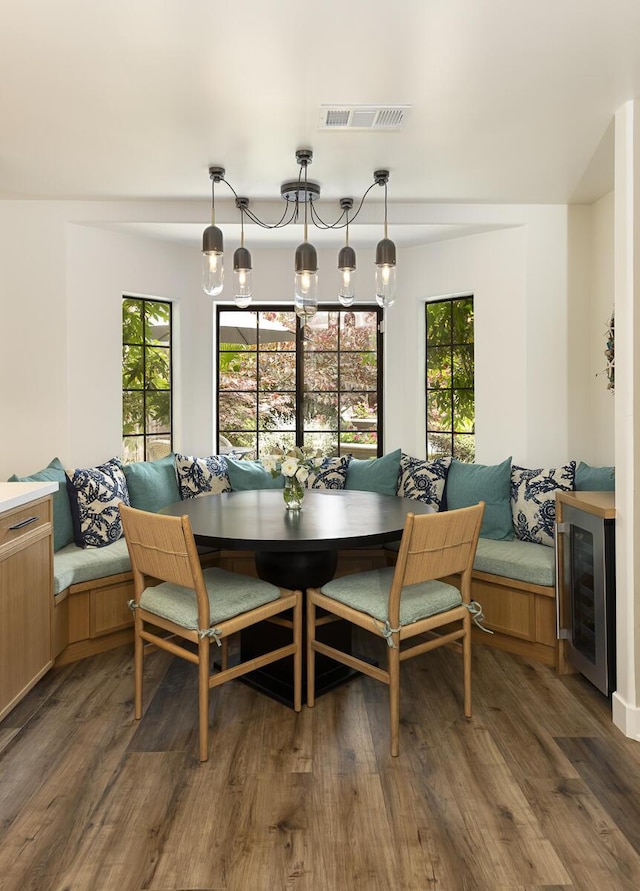 5118 Concord Pl, Carpinteria, CA 93013 - dining room with breakfast area, beverage cooler, and wood finished floors
