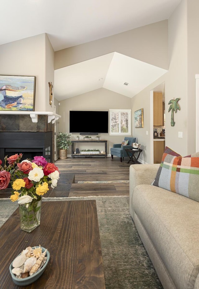 5118 Concord Pl, Carpinteria, CA 93013 - living room featuring lofted ceiling, wood finished floors, and a tile fireplace