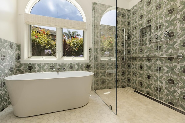5118 Concord Pl, Carpinteria, CA 93013 - full bathroom featuring tile walls, a soaking tub, a walk in shower, and tile patterned floors