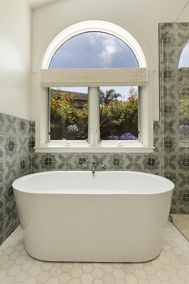 5118 Concord Pl, Carpinteria, CA 93013 - full bath with a soaking tub, tile walls, and tile patterned flooring