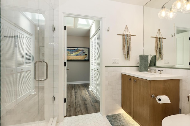5118 Concord Pl, Carpinteria, CA 93013 - full bath with vanity, tile walls, a shower stall, and a chandelier