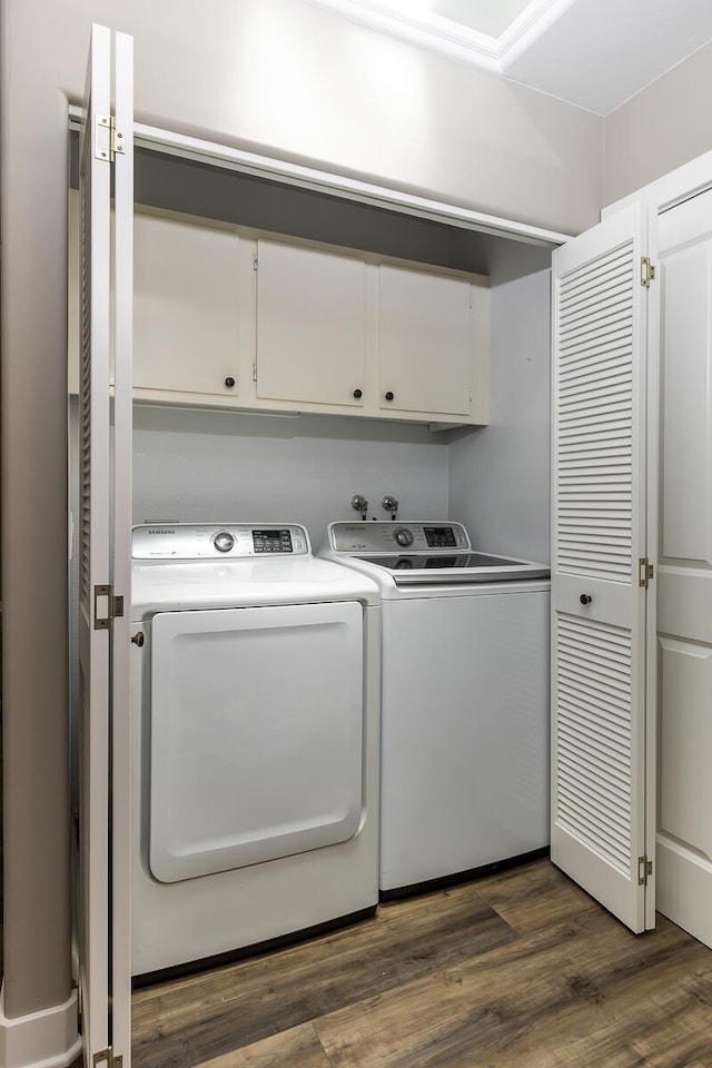 5118 Concord Pl, Carpinteria, CA 93013 - washroom with cabinet space, washer and clothes dryer, and dark wood-type flooring