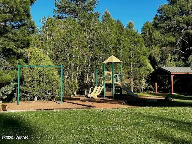 community playground featuring a lawn