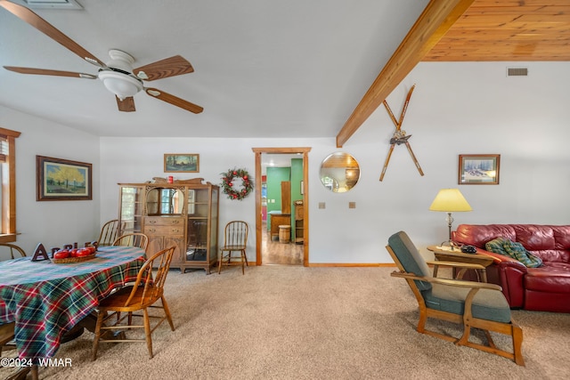 dining space featuring beamed ceiling, carpet, visible vents, and a ceiling fan