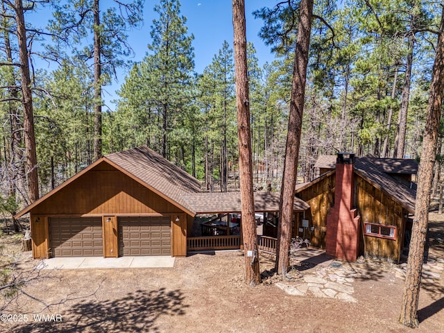 1862 Douglas Fir Dr, Pinetop, AZ 85935 - rustic home featuring roof with shingles, a chimney, and driveway