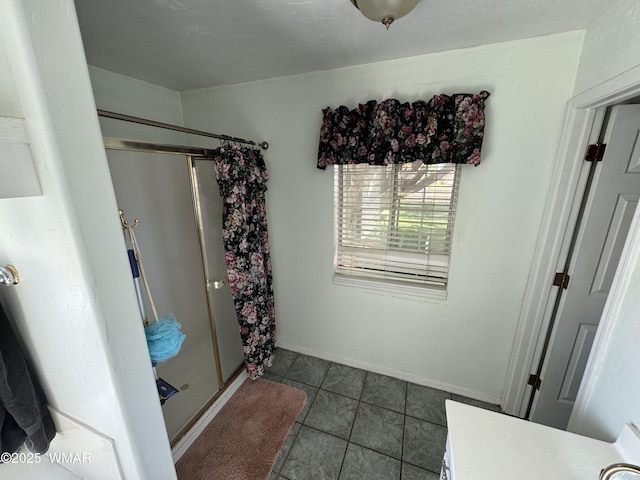 7525 E E Sherwood Rd, Snowflake, AZ 85937 - bathroom with a stall shower, tile patterned flooring, and vanity